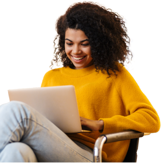A young female sat and using her laptop